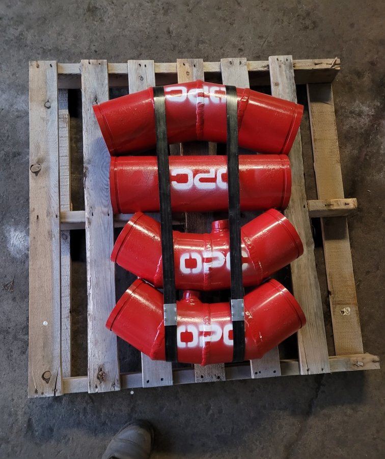 Four Hrd67 components in red enamel, stencilled OPC, strapped to a pallet